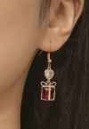 Boucles d'oreilles boîte-cadeau en cristal rouge avec garniture dorée