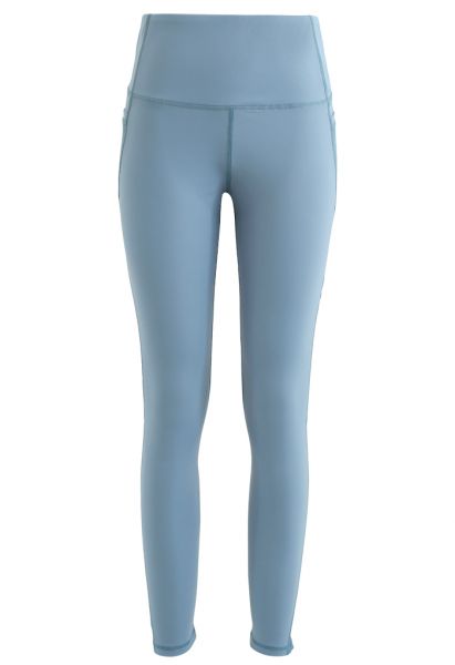 Legging longueur cheville avec poches en filet et taille haute en bleu