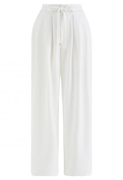Pantalon large à taille avec cordon de serrage et détails plissés en blanc