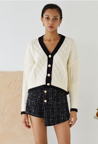 Jupe-short à rabat boutonné en tweed quadrillé en noir