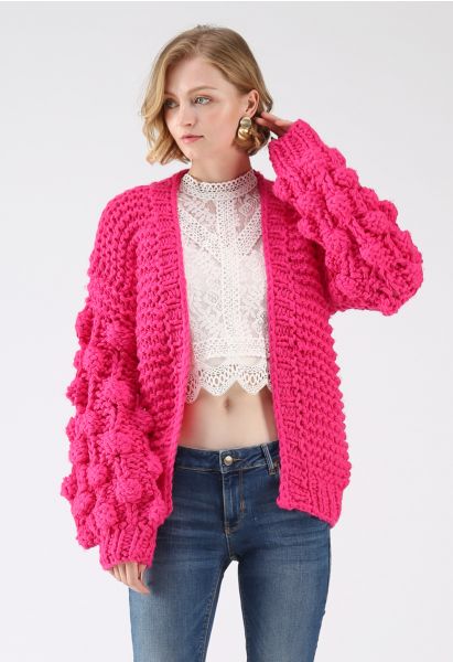 Cardigan épais manches pompon rose vif