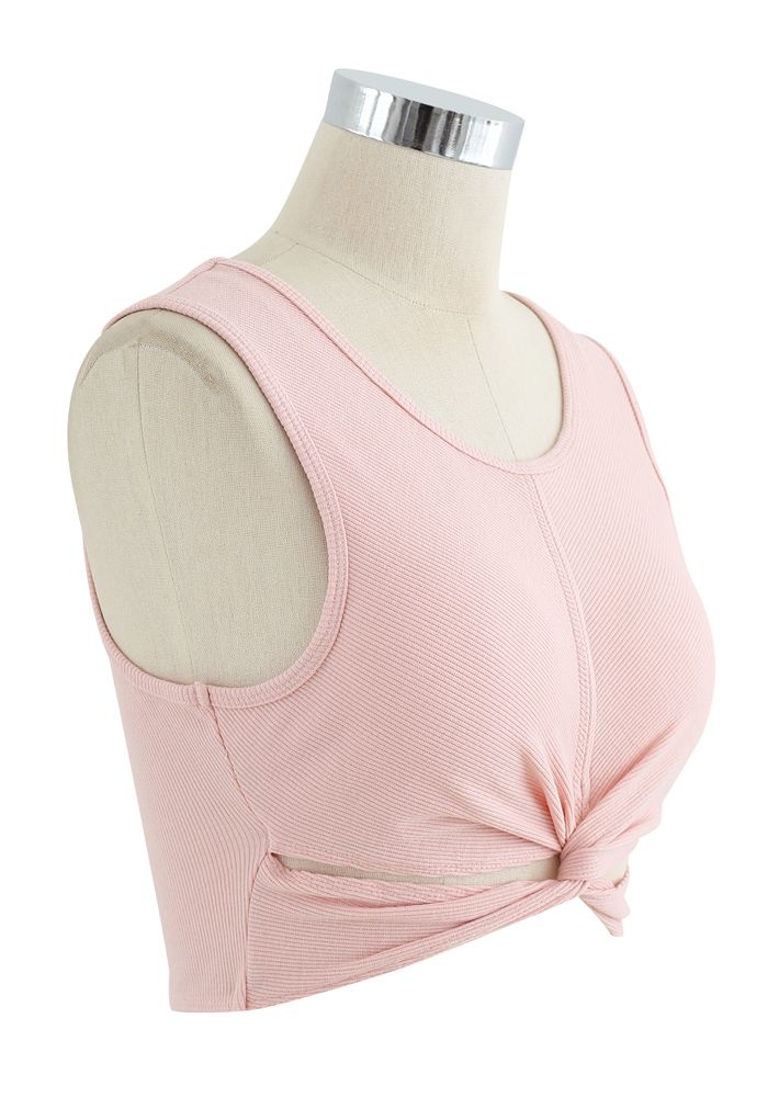 Soutien-gorge de sport côtelé sans manches à faible impact sur le devant torsadé en rose nude