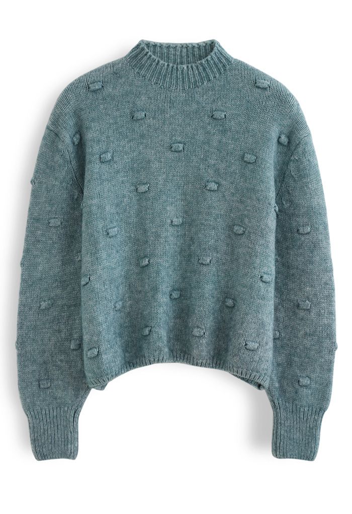 Pull en tricot à col montant et pois 3D en vert