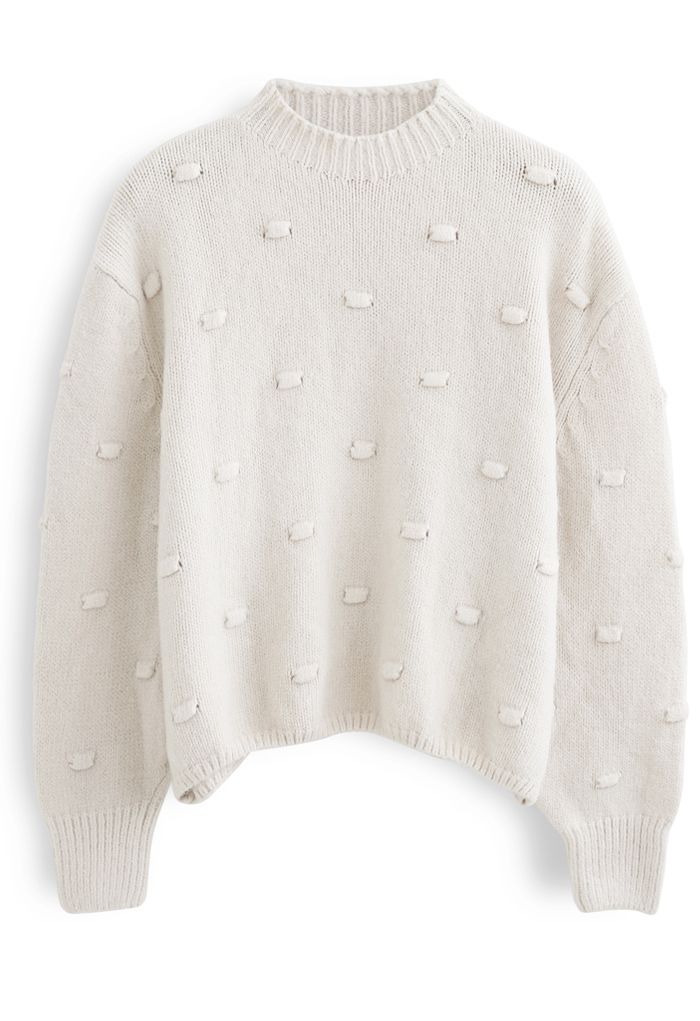 Pull en tricot à col montant et pois 3D en crème