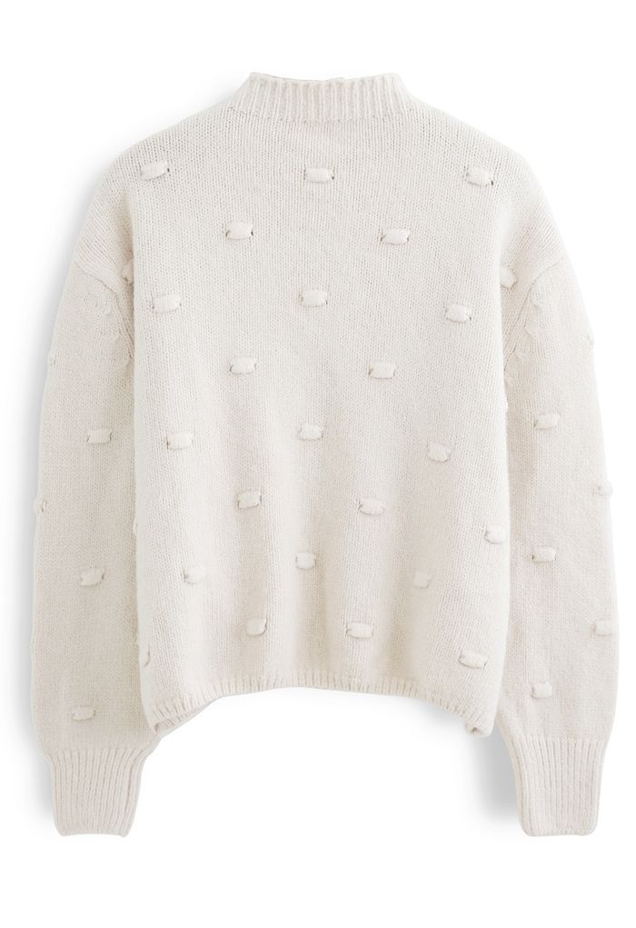 Pull en tricot à col montant et pois 3D en crème