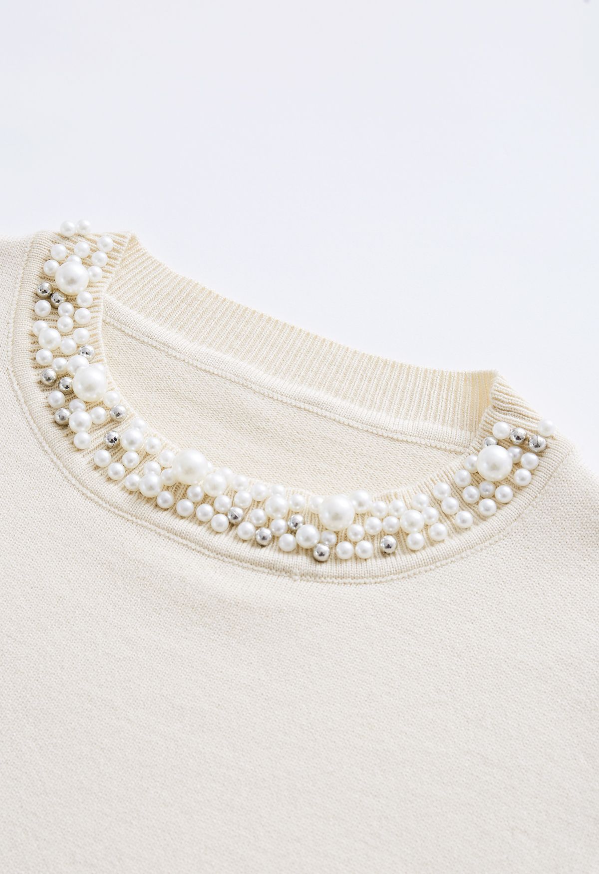 Haut en tricot doux bordé de perles en crème