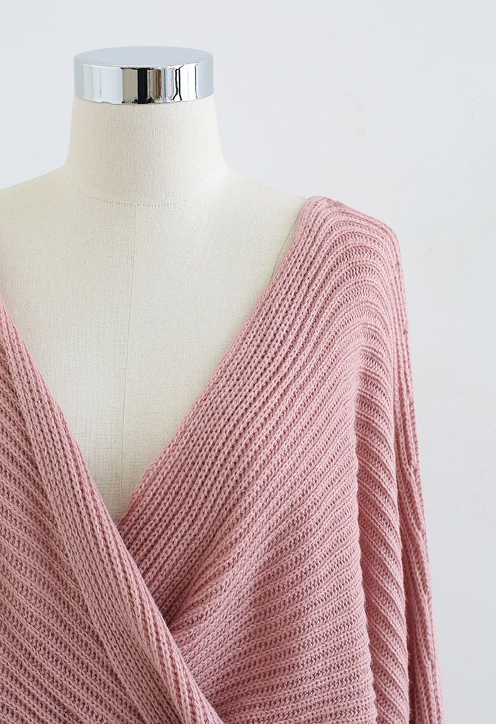 Pull en tricot à manches chauve-souris torsadées sur le devant en rose