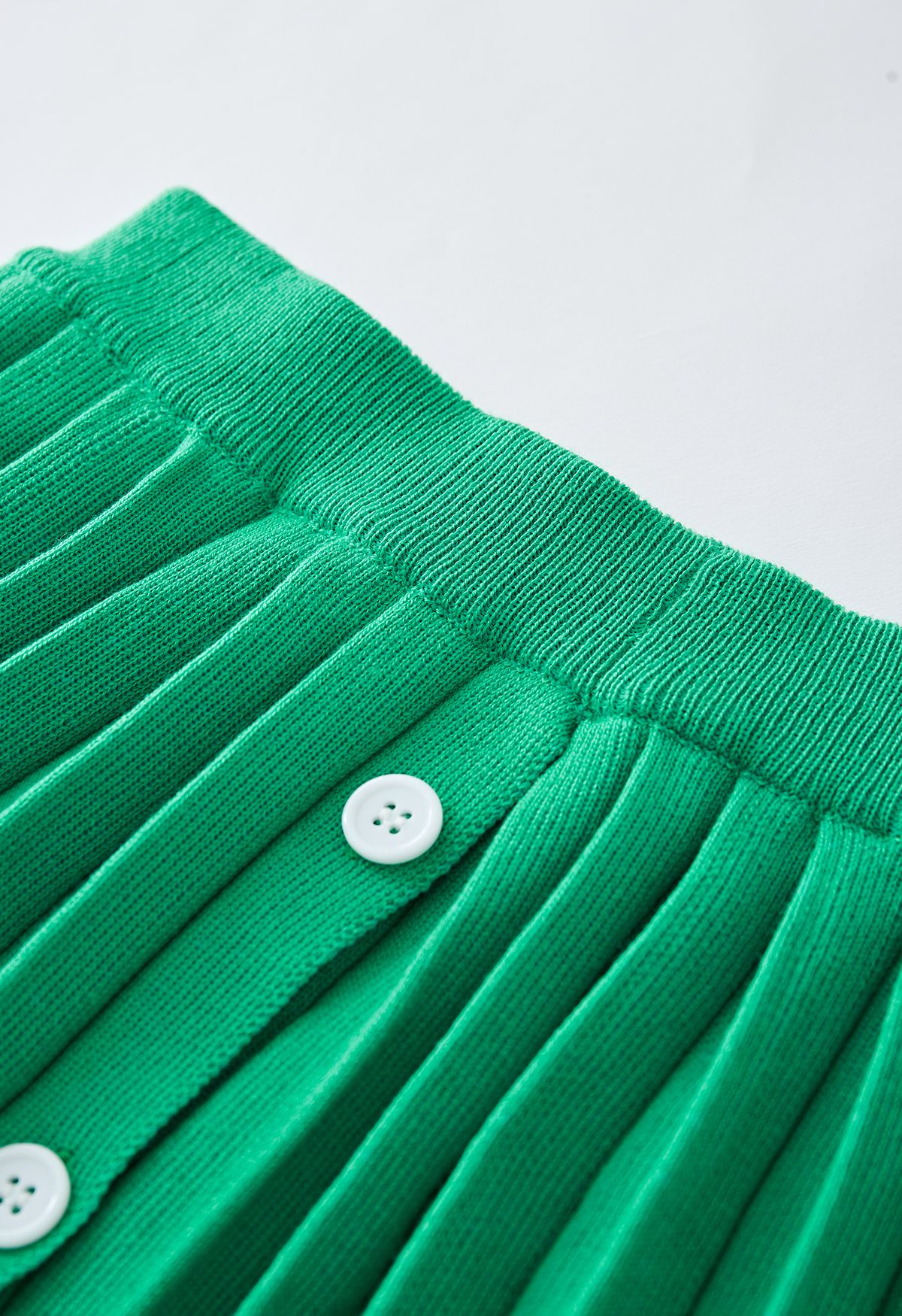 Ensemble haut en tricot à col en V et jupe plissée en vert