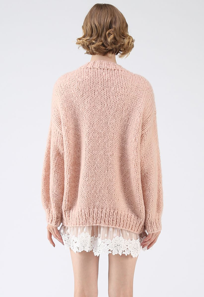 Pause pour le confortable cardigan en tricot à la main Chunky rose