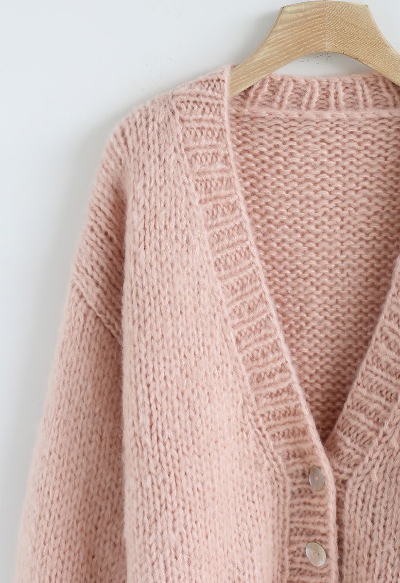 Pause pour le confortable cardigan en tricot à la main Chunky rose