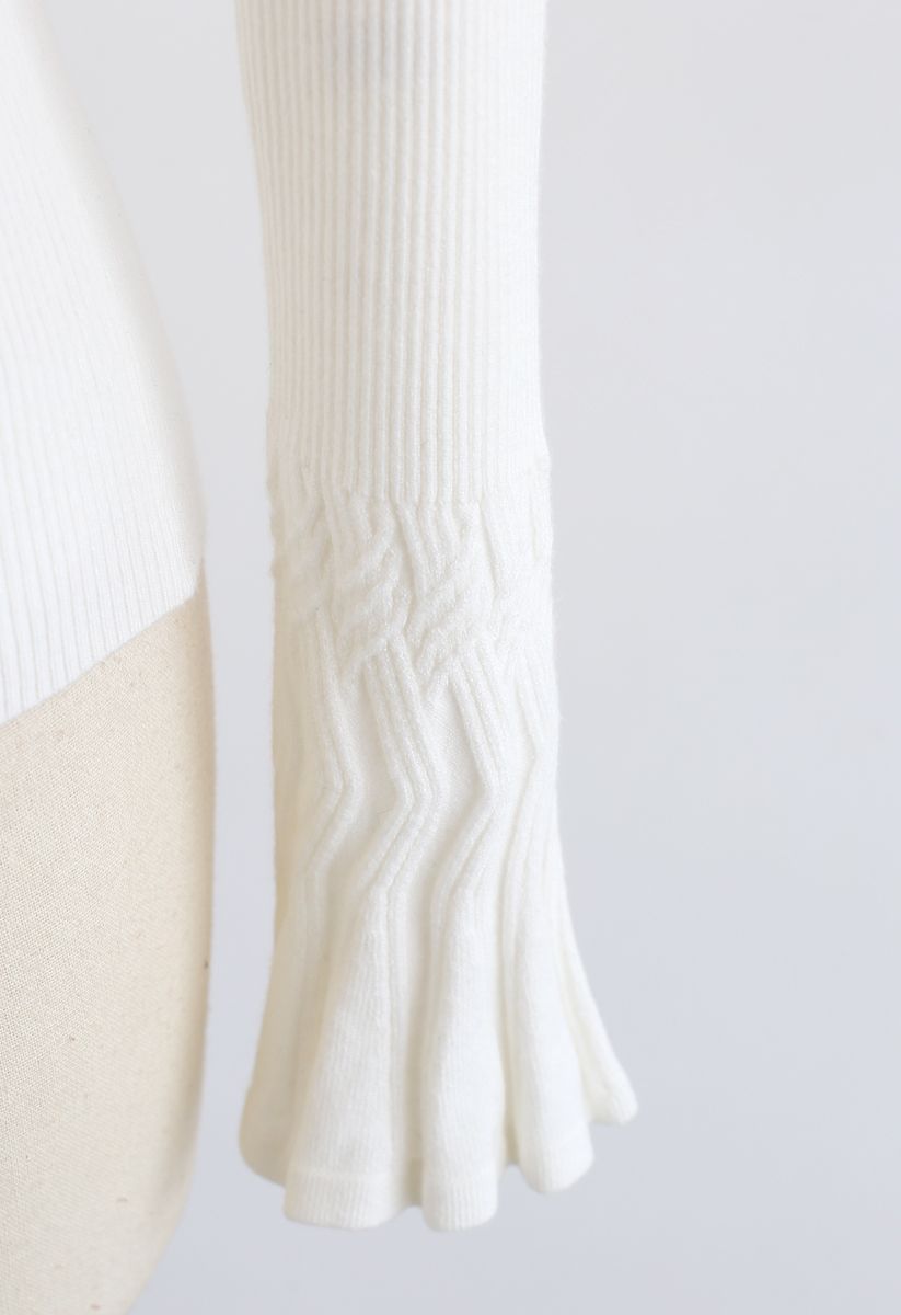 Top en tricot avec nœud blanc