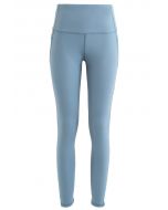 Legging longueur cheville avec poches en filet et taille haute en bleu