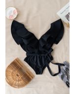 Maillot de bain une pièce à volants et col en V plongeant en noir