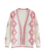 Cardigan rose en maille à pompons et surpiqûres à fleurs