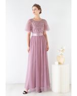 Robe en tulle à manches volantées et sequins en rose poudré