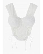 Crop top bustier à lacets fleur 3D en blanc